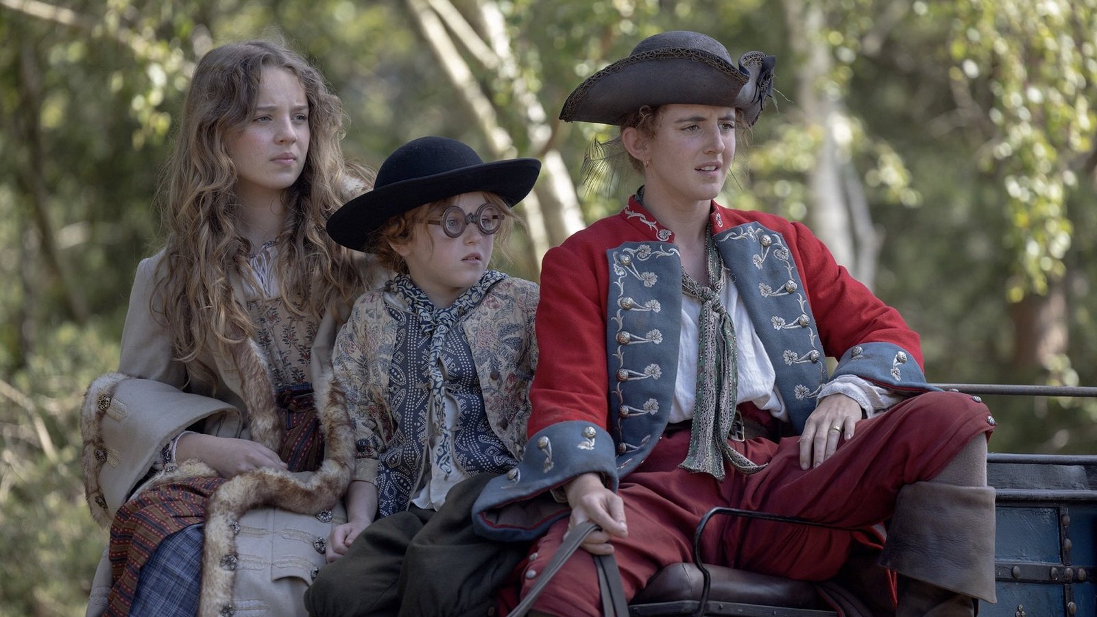 images-1-fill_-size_2000x1125-v1711486070 Three young women sit on top of a carriage.