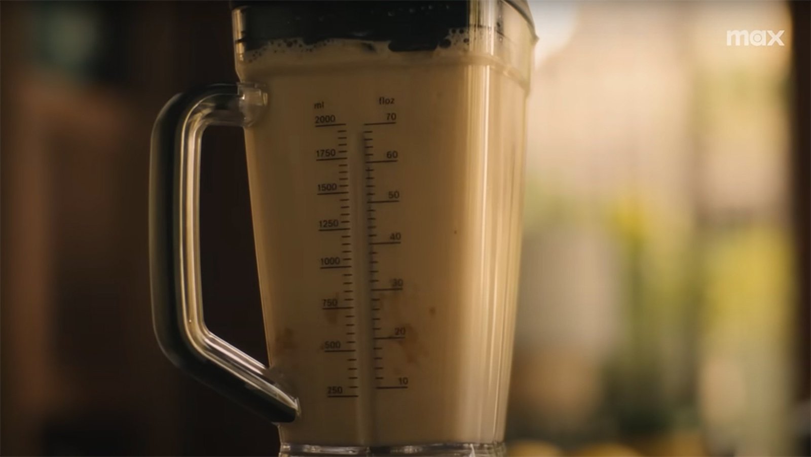 A close-up of some pale liquid in a blender.