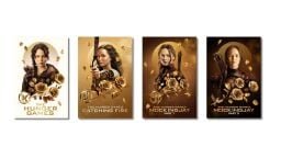 four movie posters from the hunger games