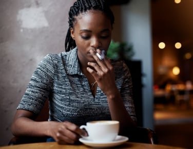 images-11-fit_lim-size_376x-1 AI-generated image of woman smoking cigarette in paris cafe