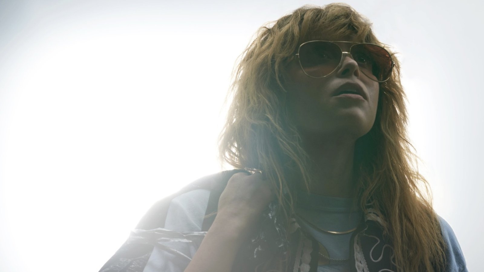 images-2-fill_-size_2000x1125-v1685718250 A red-haired woman in sunglasses and a jean jacket.