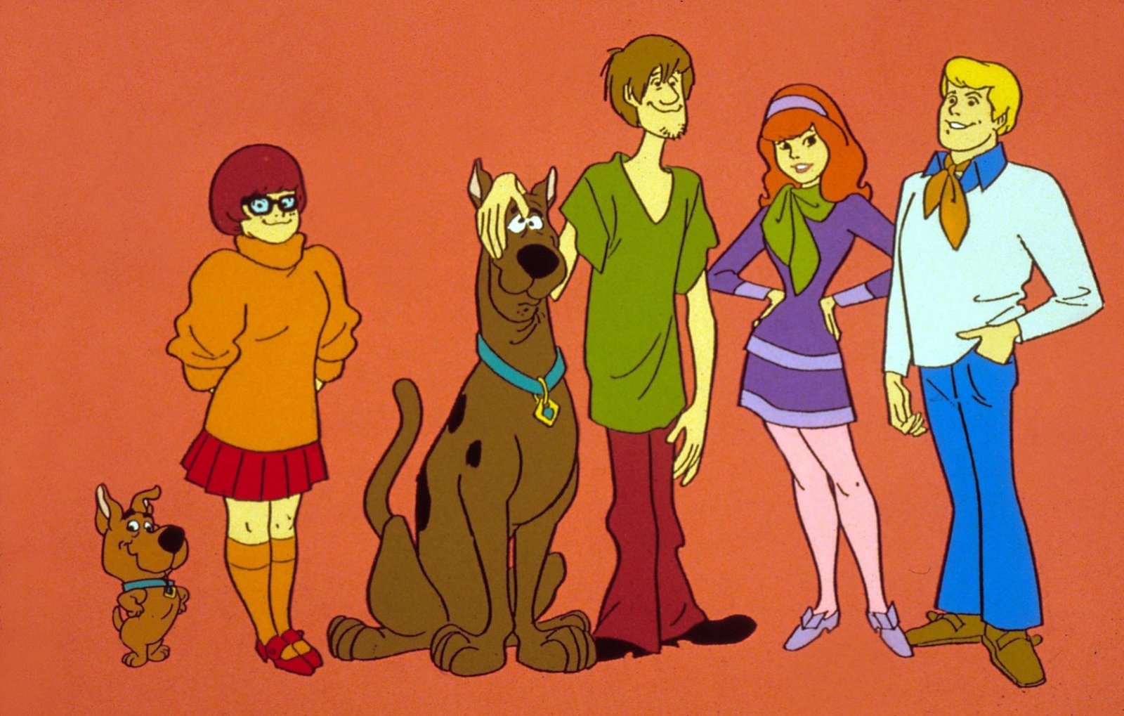 Four animated teens and two dogs from "Scooby Doo" stand in a line.