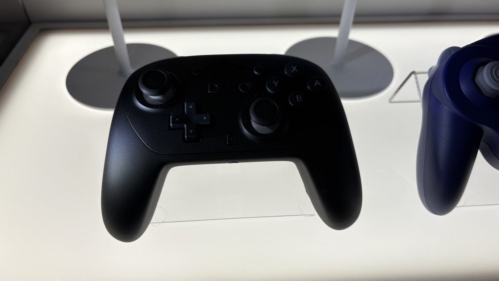 images-4-fill_-size_2000x1125-v1745514741 Nintendo Switch 2 Pro Controller behind glass case