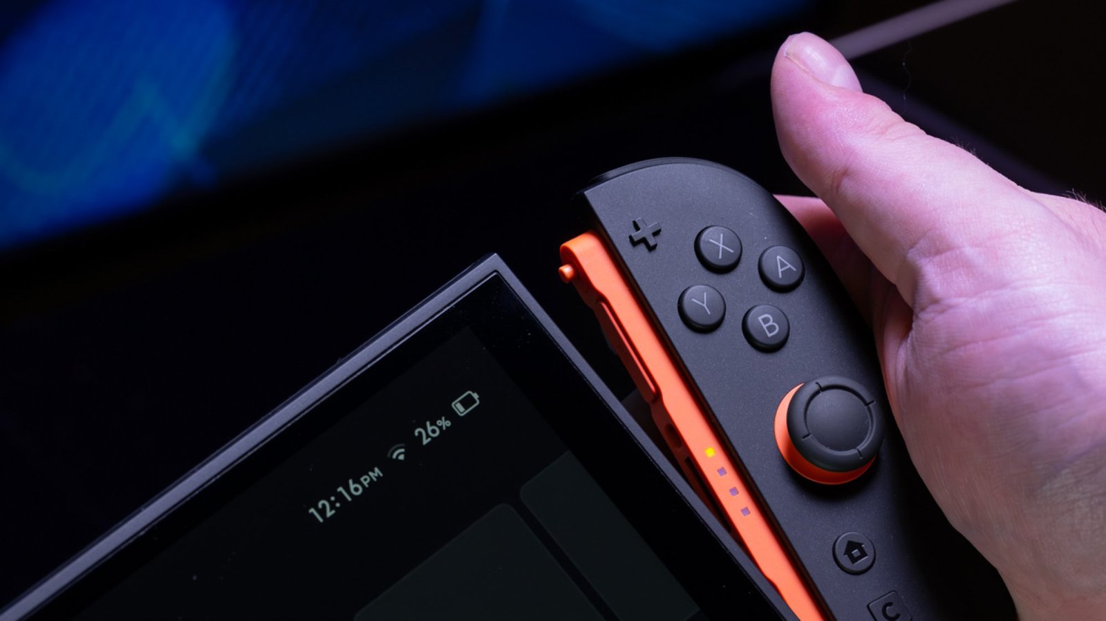A Nintendo Switch 2 Joy-Con being detached from the console